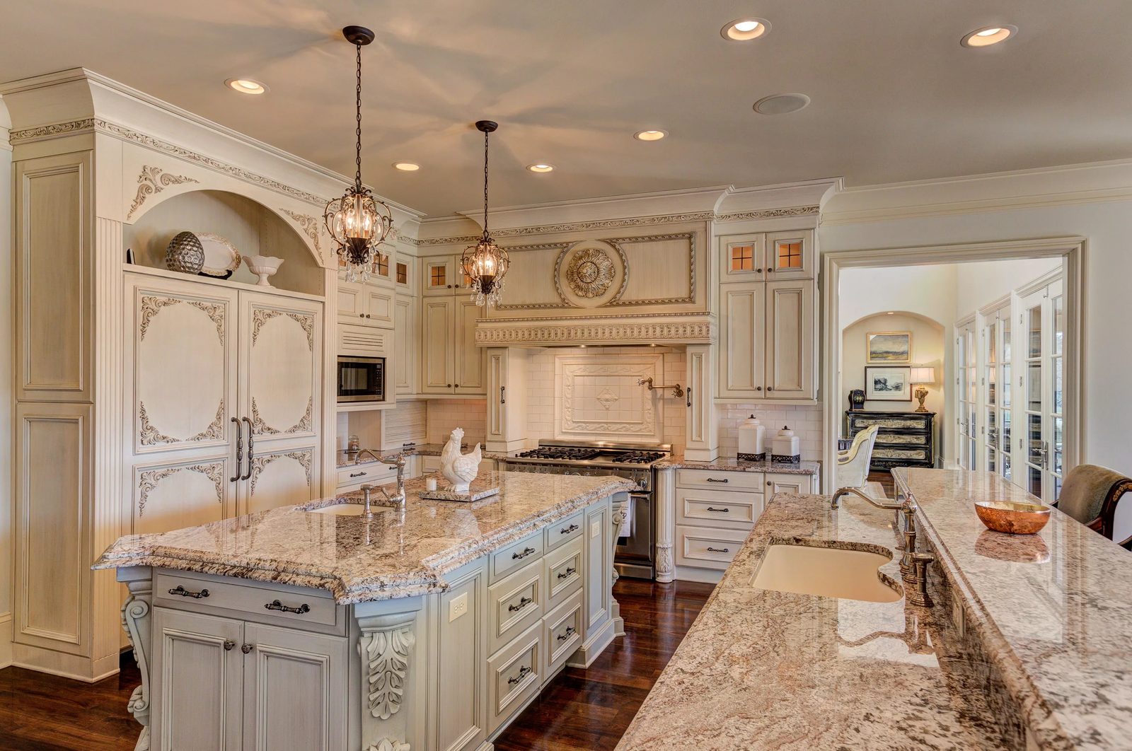 Custom kitchen with double island and custom cabinetry