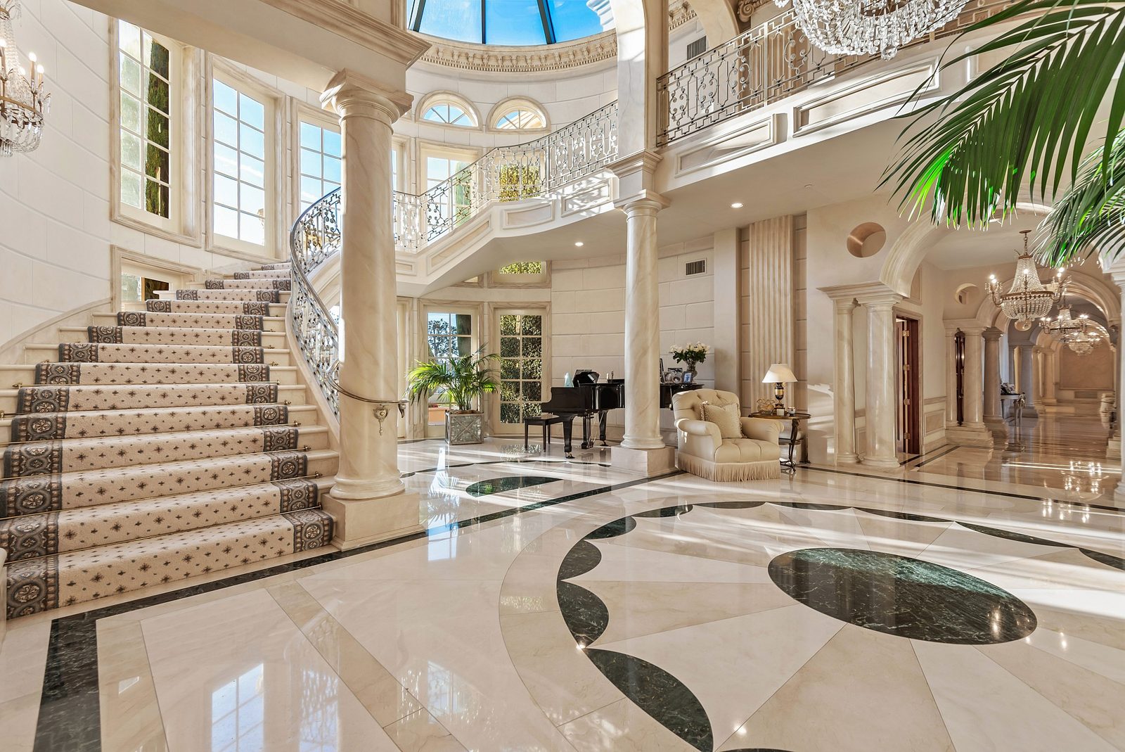 Curved staircase with detailed millwork