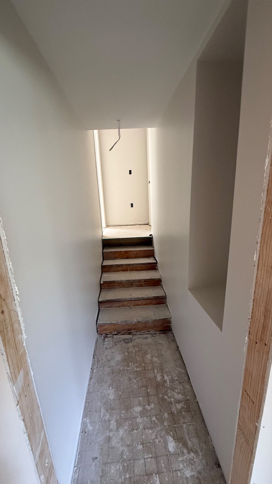 Fresh drywall and rebuilt staircase at Greenville House